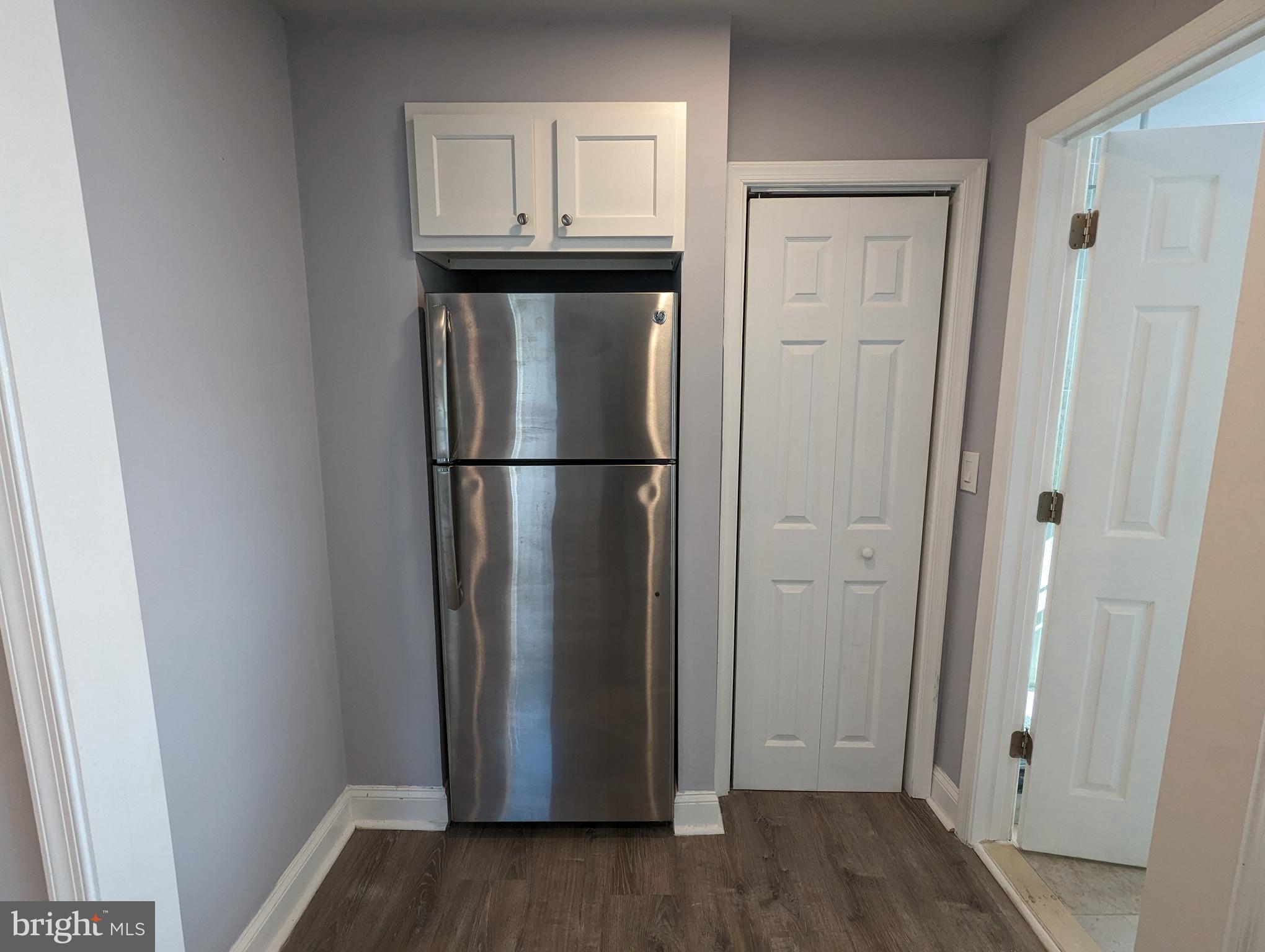 401 Montgomery Street, Unit 2 Laurel, MD 20707 - Photo 7 of 13 a view of a room with wooden floor and closet