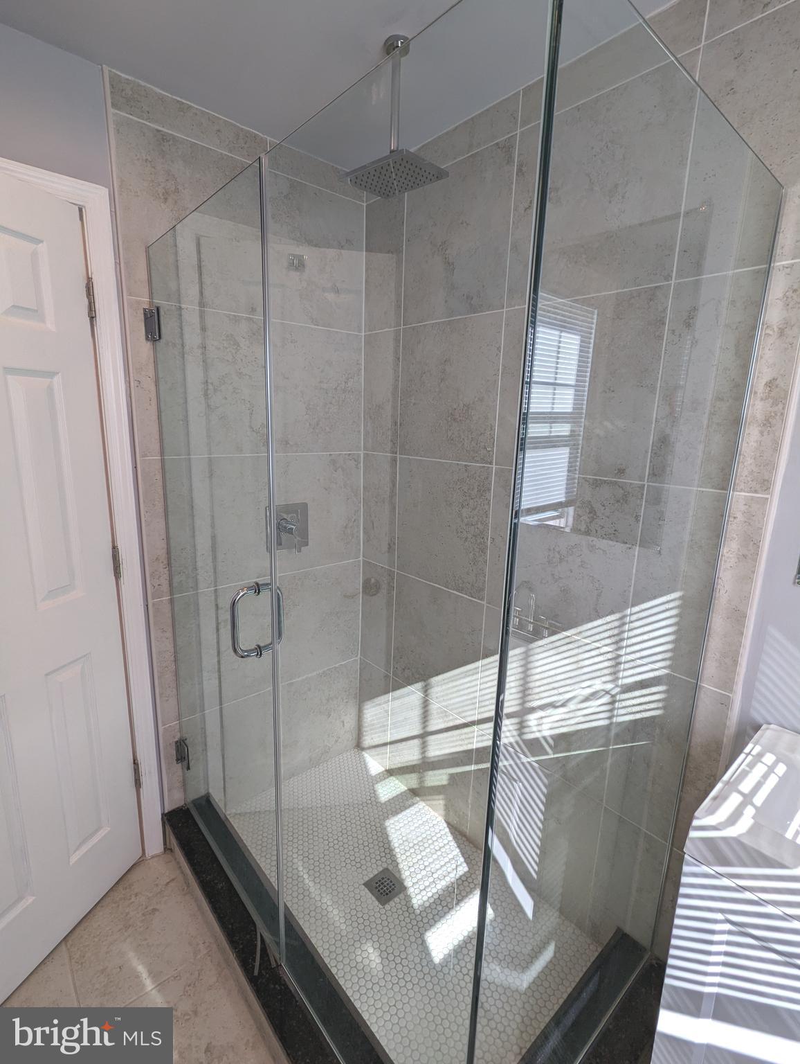 401 Montgomery Street, Unit 2 Laurel, MD 20707 - Photo 9 of 13 a bathroom with a shower