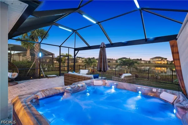 a view of a swimming pool with a patio