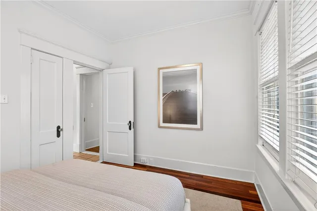 a bathroom with a granite countertop sink toilet a mirror and bathtub