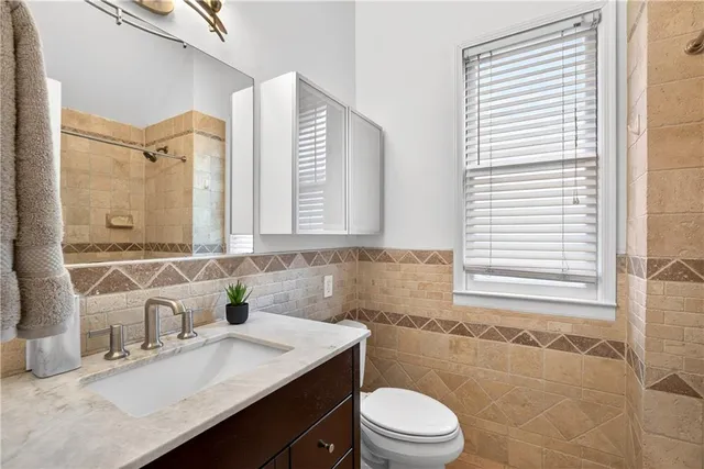 a view of entryway with wooden floor and stairs