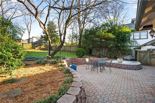 a house view with a sitting space and garden space