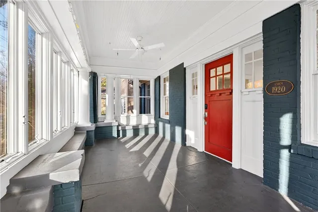 a view of a hallway with windows and stairs