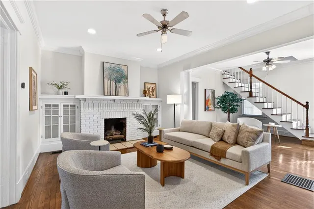 a living room with furniture and a fireplace