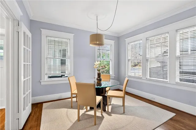 a dining room with furniture and windows