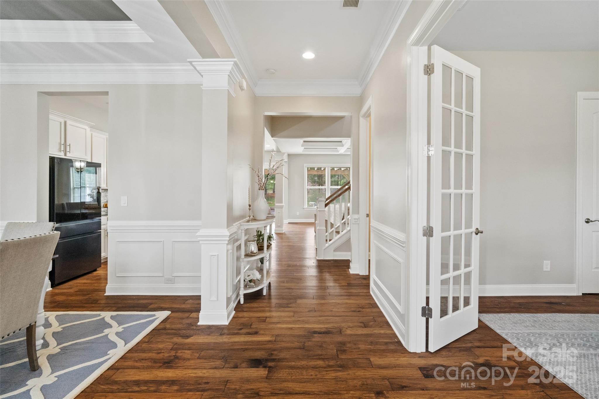 1022 Torrens Drive Monroe, NC 28110 - Photo 15 of 46 a view of a hallway with wooden floor and a living room
