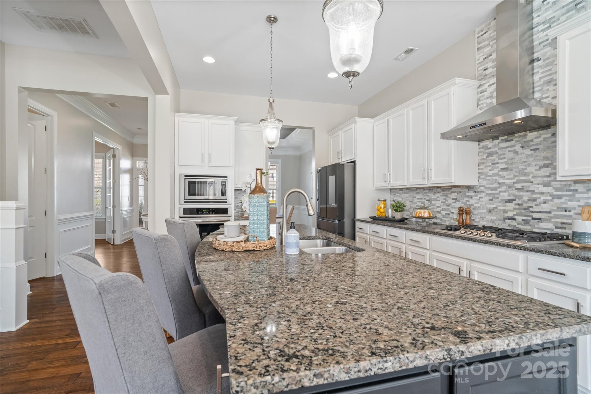 1022 Torrens Drive Monroe, NC 28110 - Photo 22 of 46 a large kitchen with granite countertop a counter space a sink stainless steel appliances and cabinets