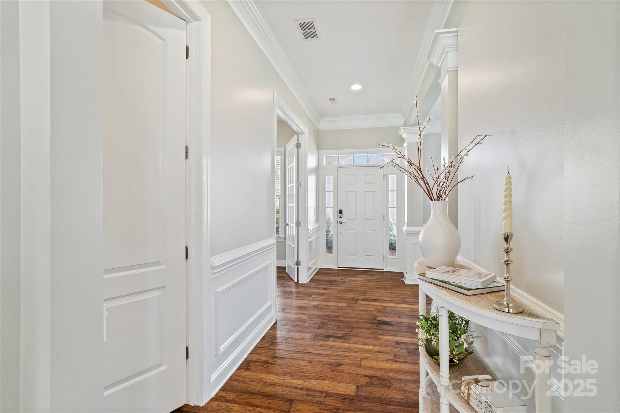1022 Torrens Drive Monroe, NC 28110 - Photo 24 of 46 a view of a hallway with wooden floor and staircase