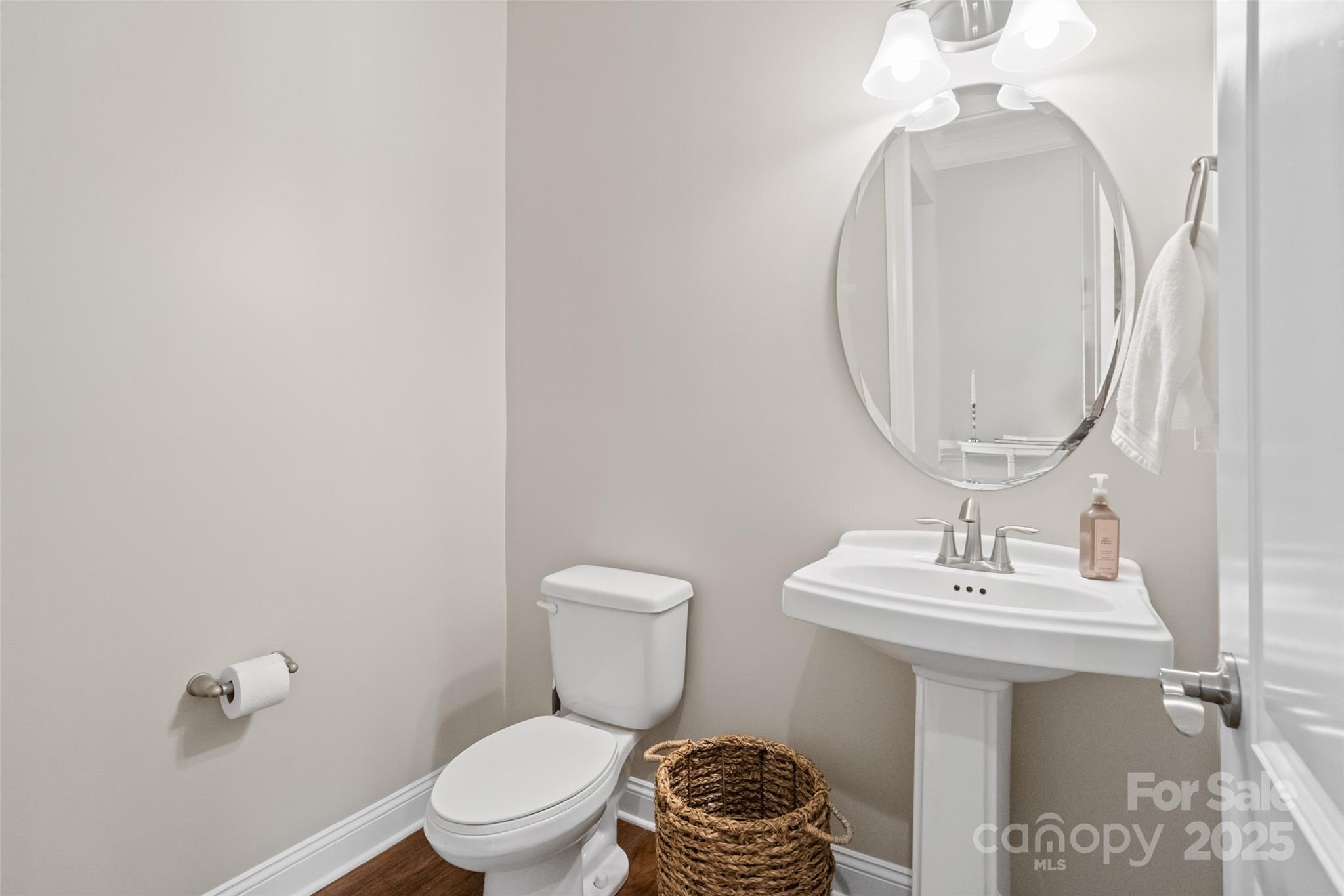 1022 Torrens Drive Monroe, NC 28110 - Photo 25 of 46 a bathroom with a toilet a sink and a mirror