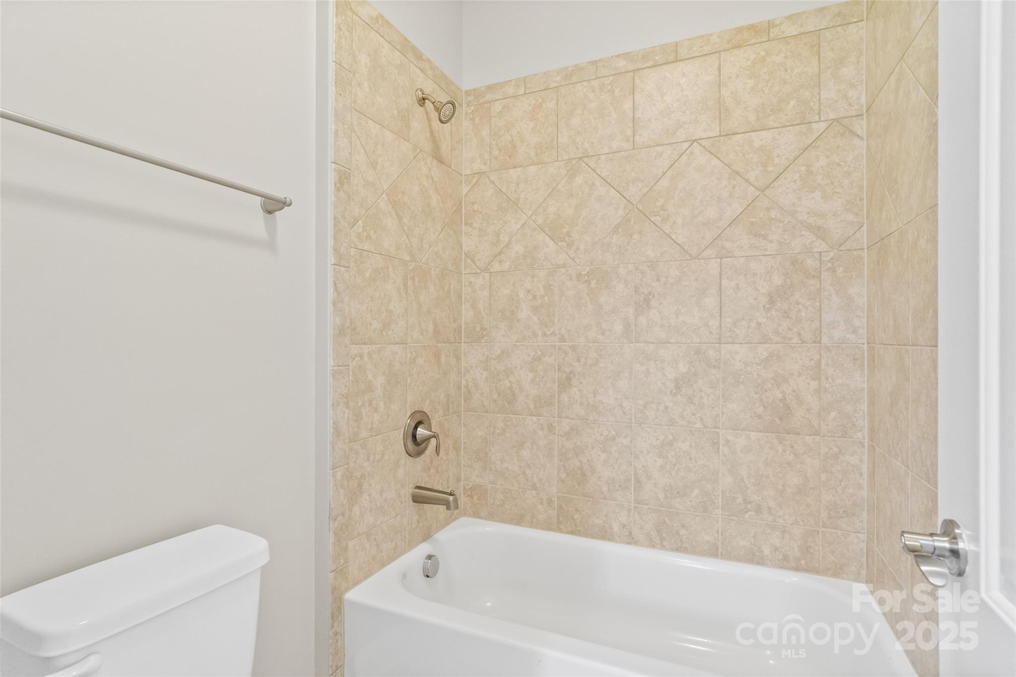 1022 Torrens Drive Monroe, NC 28110 - Photo 41 of 46 a bathroom with a bathtub and a toilet