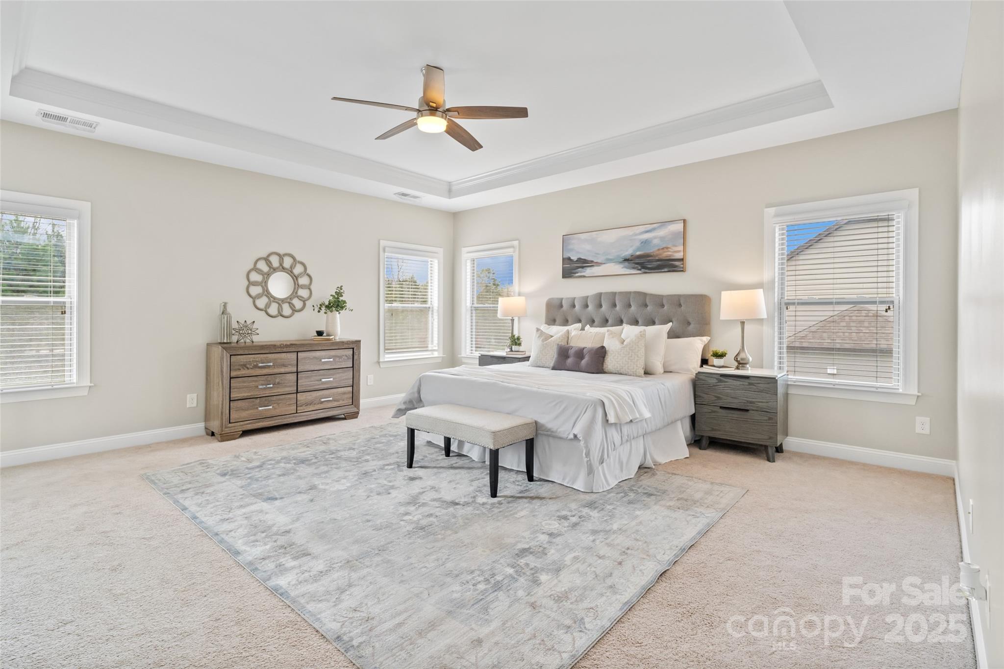 1022 Torrens Drive Monroe, NC 28110 - Photo 43 of 46 a bedroom with a large bed and a chandelier