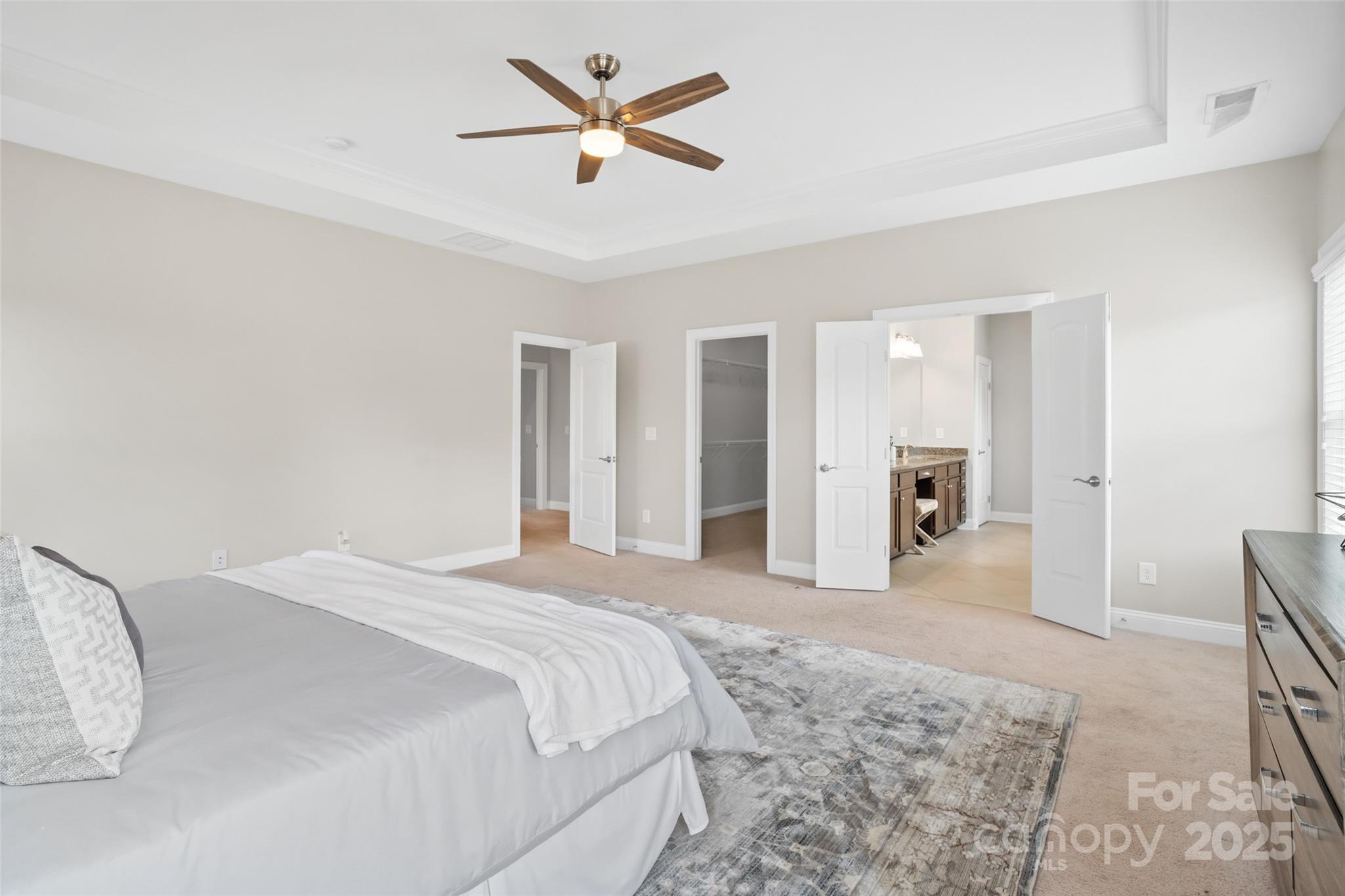 1022 Torrens Drive Monroe, NC 28110 - Photo 44 of 46 a spacious bedroom with a bed and a chandelier