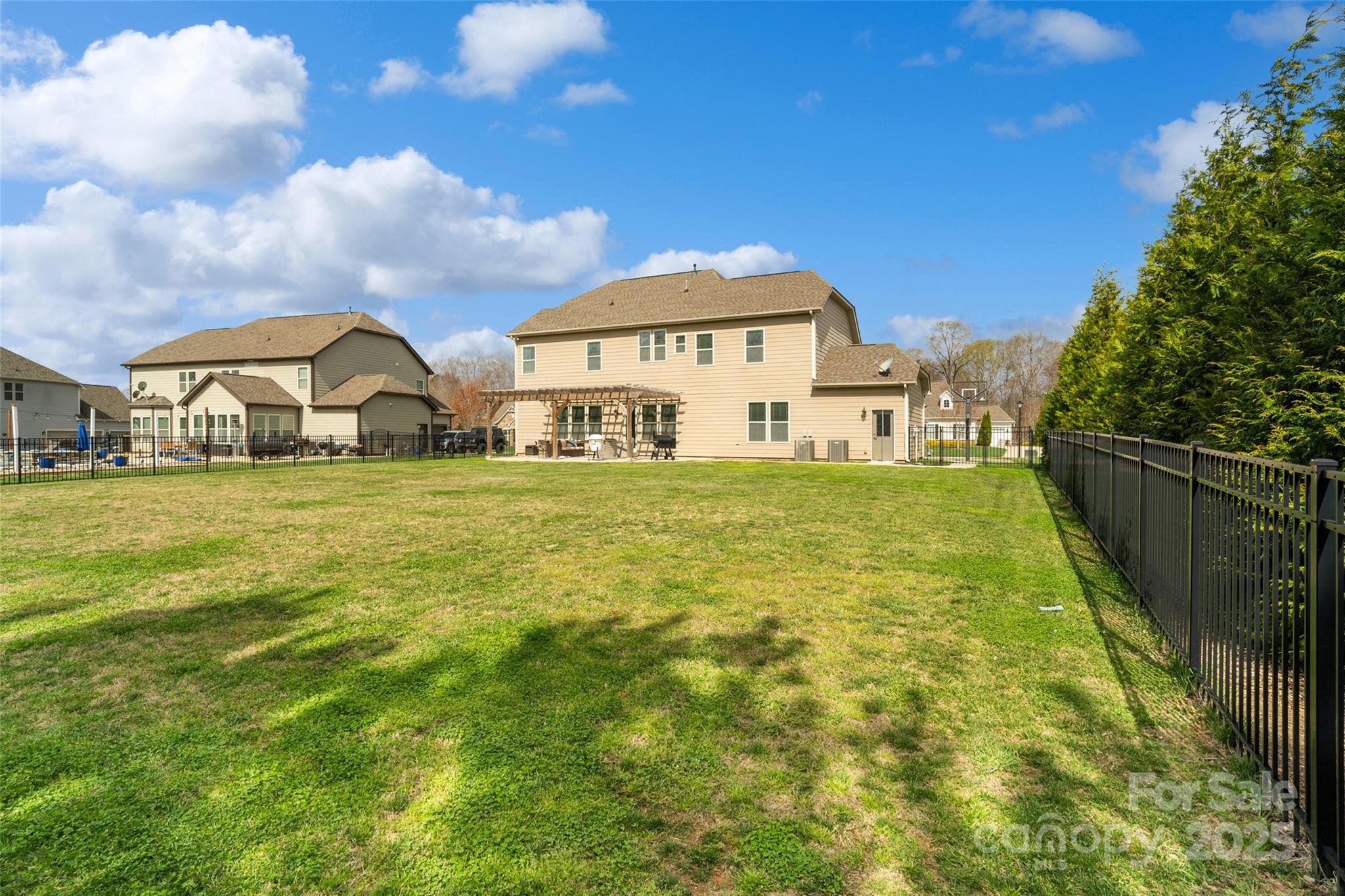 1022 Torrens Drive Monroe, NC 28110 - Photo 7 of 46 a view of a house with a big yard and large trees