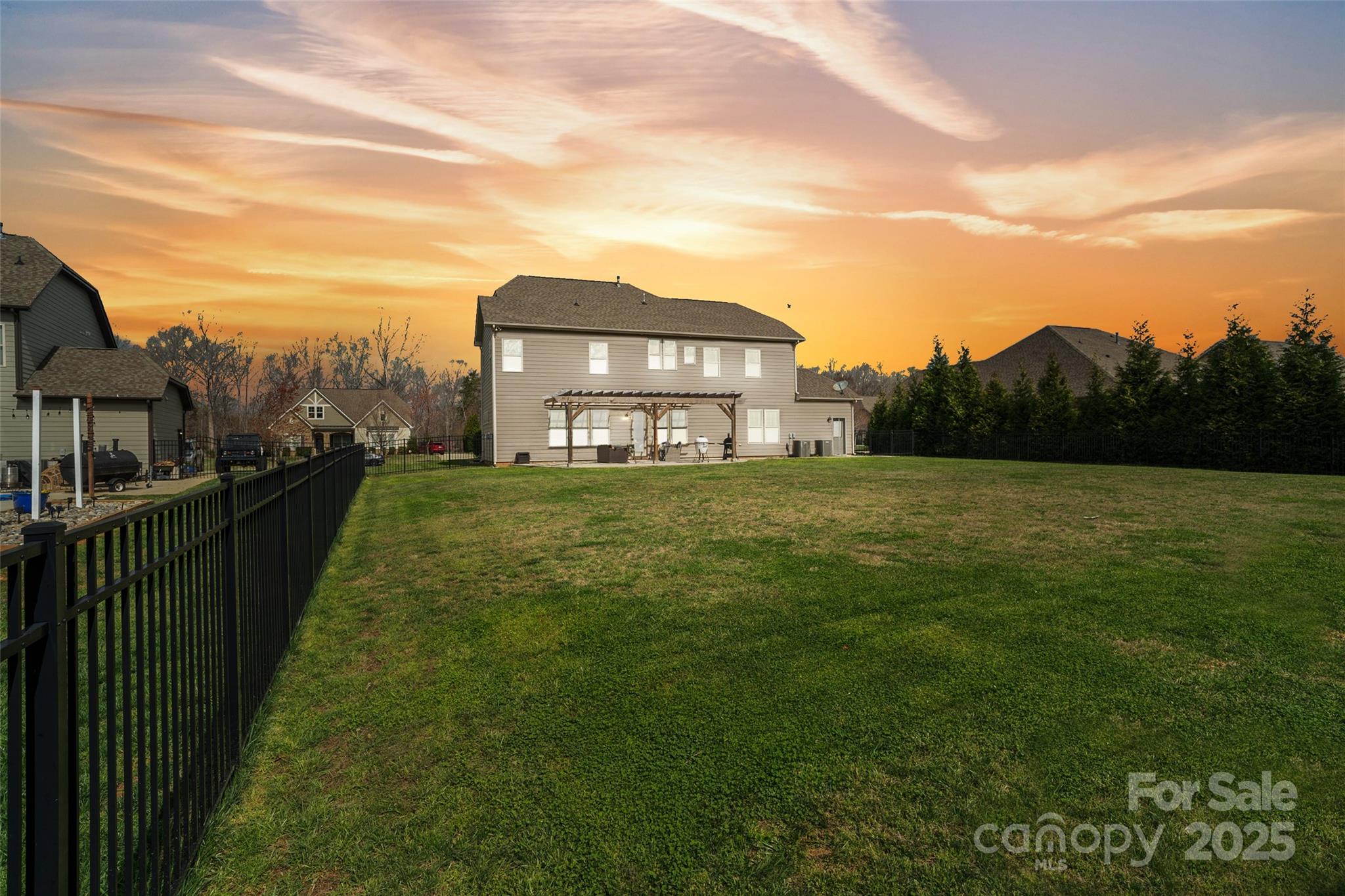 1022 Torrens Drive Monroe, NC 28110 - Photo 8 of 46 a view of a house with a big yard and large trees