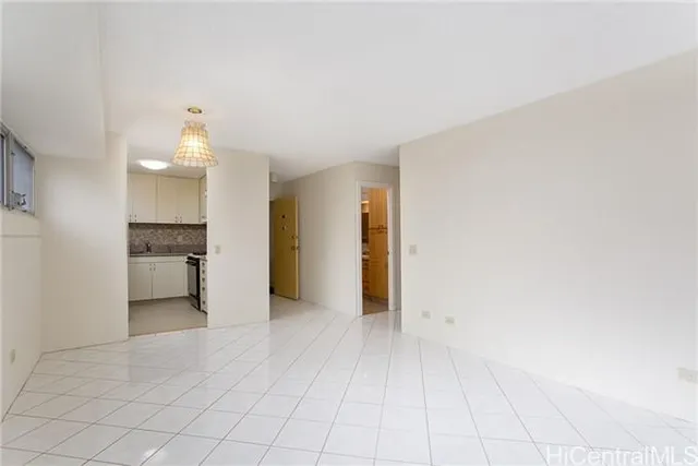 a view of a kitchen with a sink and cabinets