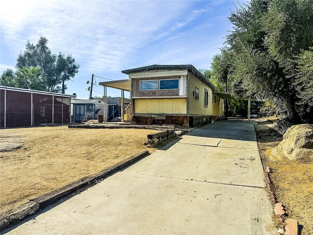 a swimming pool with outdoor seating and yard