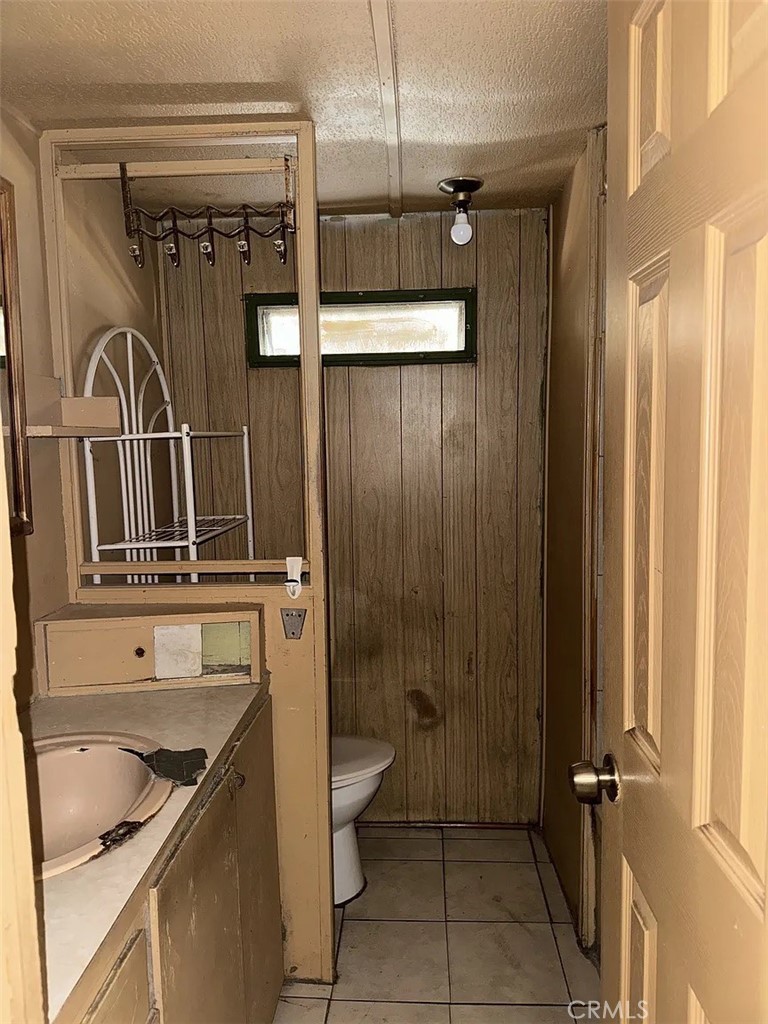 640 Apache Road Perris, CA 92570 - Photo 6 of 10 a bathroom with a sink a toilet and shower