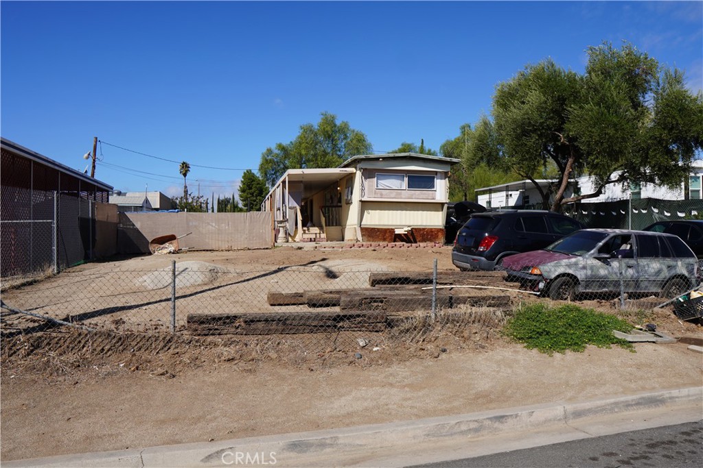 640 Apache Road Perris, CA 92570 - Photo 8 of 10 a view of a backyard with table and chairs