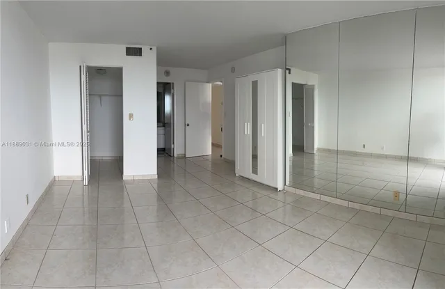 an empty room with a elevator