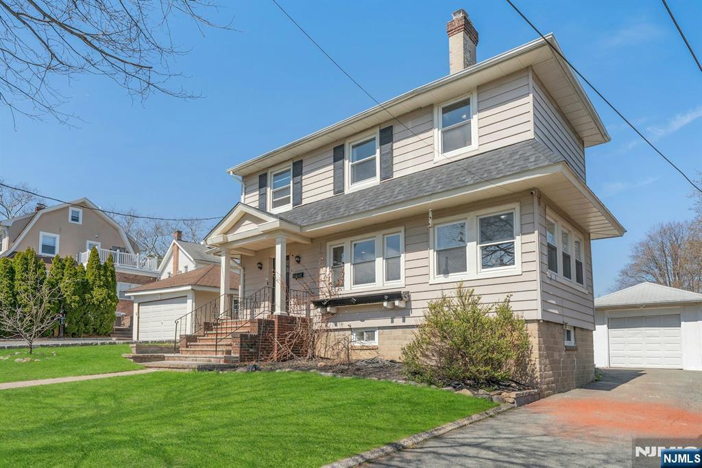 39 Vernon Terrace Bloomfield, NJ 07003 - Photo 1 of 39 a front view of a house with a yard