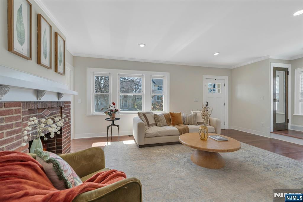 39 Vernon Terrace Bloomfield, NJ 07003 - Photo 11 of 39 a living room with furniture and a fireplace