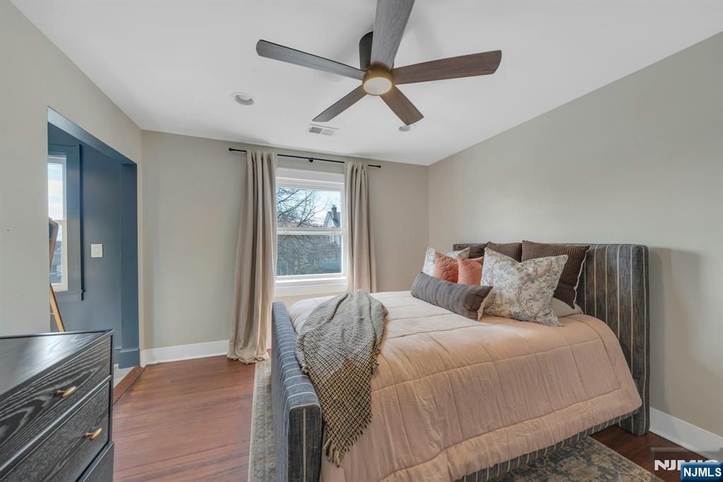 39 Vernon Terrace Bloomfield, NJ 07003 - Photo 18 of 39 a bedroom with a large bed and a ceiling fan