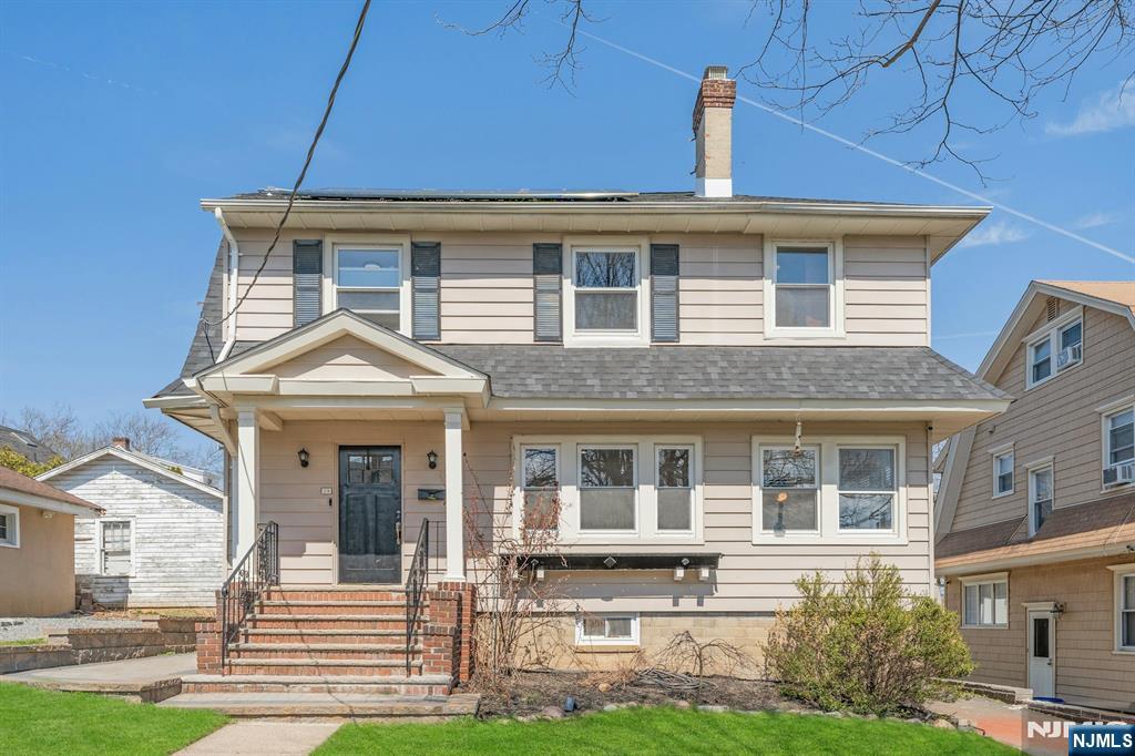 39 Vernon Terrace Bloomfield, NJ 07003 - Photo 2 of 39 front view of a house with a yard