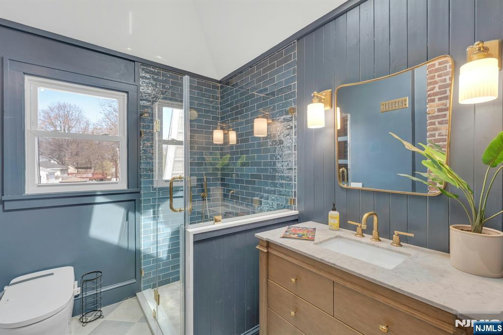39 Vernon Terrace Bloomfield, NJ 07003 - Photo 22 of 39 a bathroom with a sink and a mirror