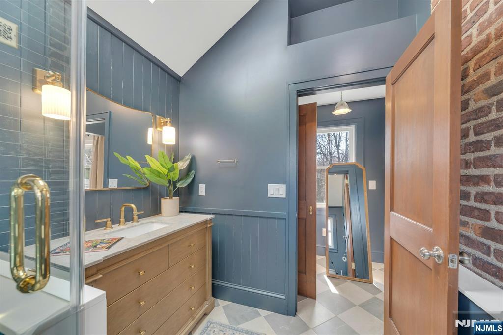 39 Vernon Terrace Bloomfield, NJ 07003 - Photo 23 of 39 a bathroom with a sink and a mirror