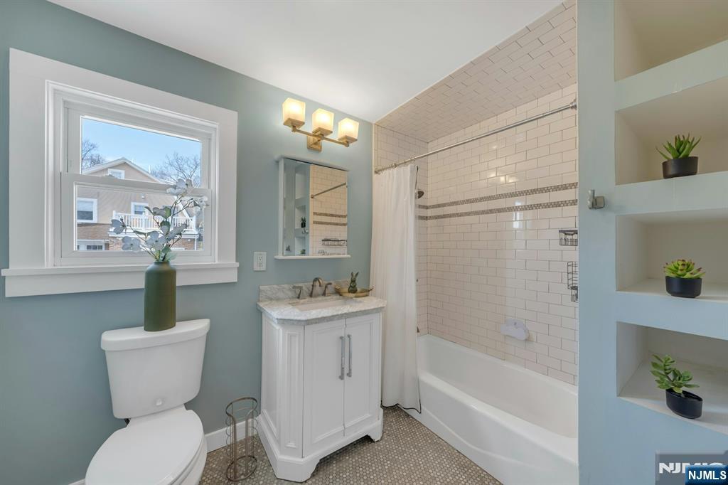 39 Vernon Terrace Bloomfield, NJ 07003 - Photo 26 of 39 a bathroom with a toilet sink and shower