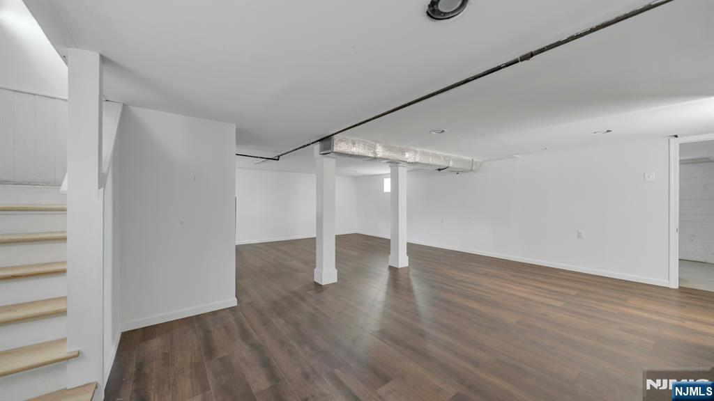 39 Vernon Terrace Bloomfield, NJ 07003 - Photo 28 of 39 a view of an empty room with wooden floor and closet