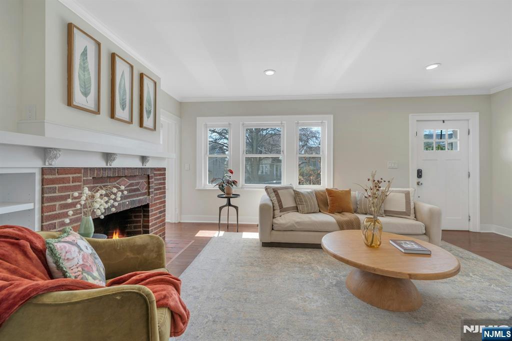 39 Vernon Terrace Bloomfield, NJ 07003 - Photo 7 of 39 a living room with furniture and a fireplace