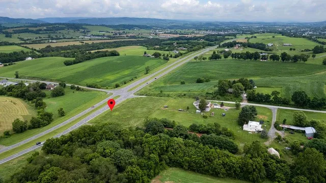 a view of a green field with sitting area