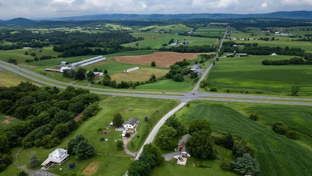 an aerial view of a golf course with parking space