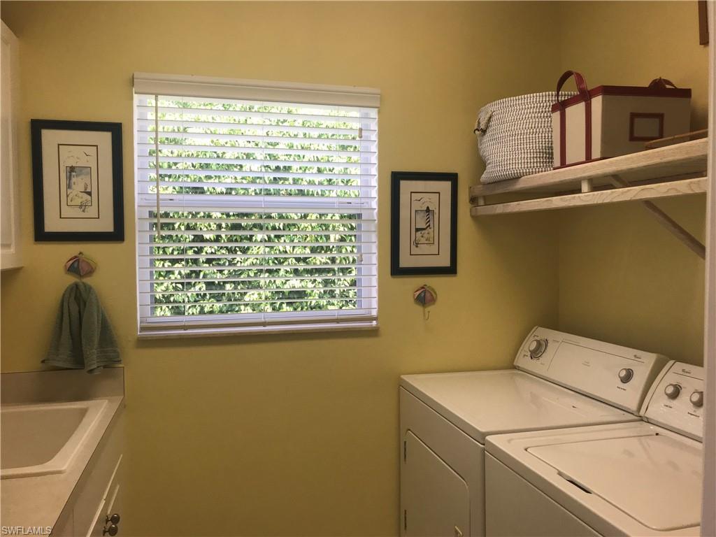 120 Forest Hills Boulevard Naples, FL 34113 - Photo 15 of 24 a utility room with dryer and washer