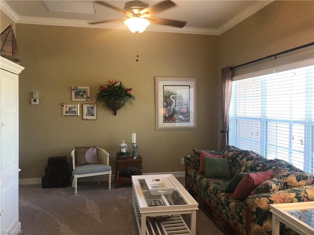 120 Forest Hills Boulevard Naples, FL 34113 - Photo 23 of 24 a living room with furniture and a window