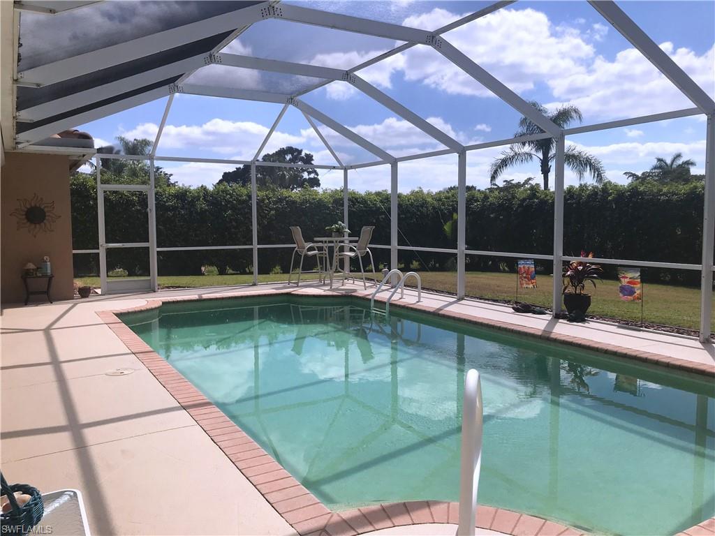 120 Forest Hills Boulevard Naples, FL 34113 - Photo 10 of 24 a view of a swimming pool with a patio