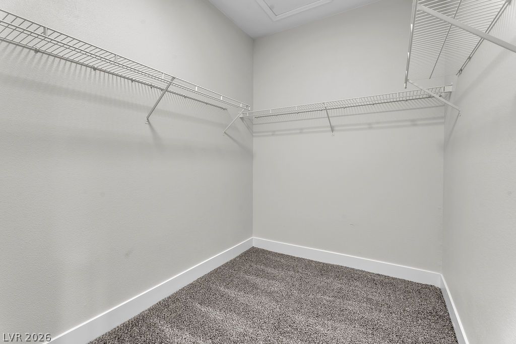 2139 Chapman Ranch Drive Henderson, NV 89012 - Photo 51 of 58 Well-organized storage solutions in this tidy closet, providing ample space for personal belongings.