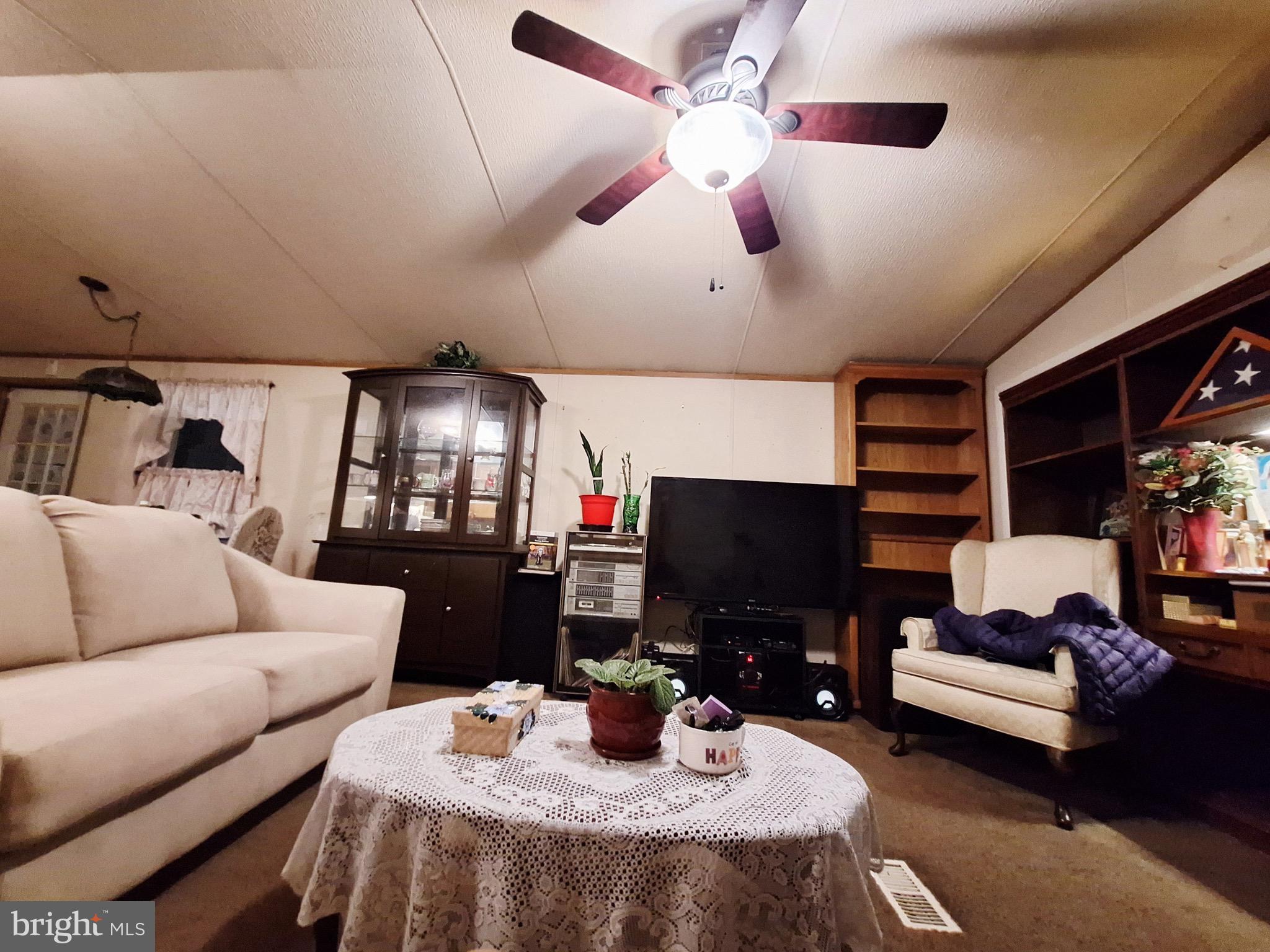 545 Imperial Way Falling Waters, WV 25419 - Photo 13 of 20 a work room with furniture and a flat screen tv