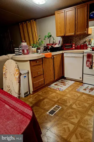 a view of a kitchen with appliances and cabinets