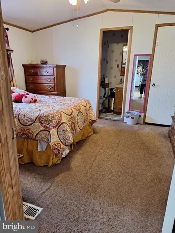 a bedroom with a bed and cabinets