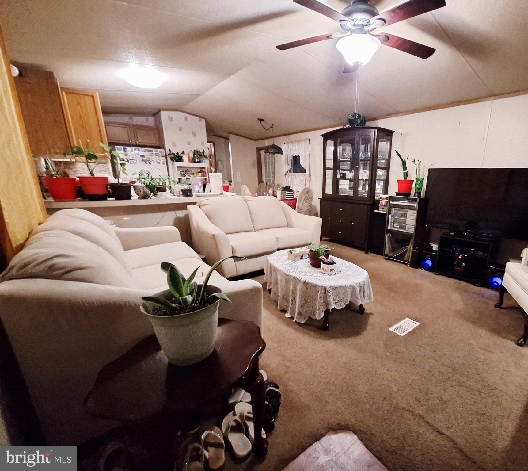 545 Imperial Way Falling Waters, WV 25419 - Photo 10 of 20 a living room with furniture and a flat screen tv