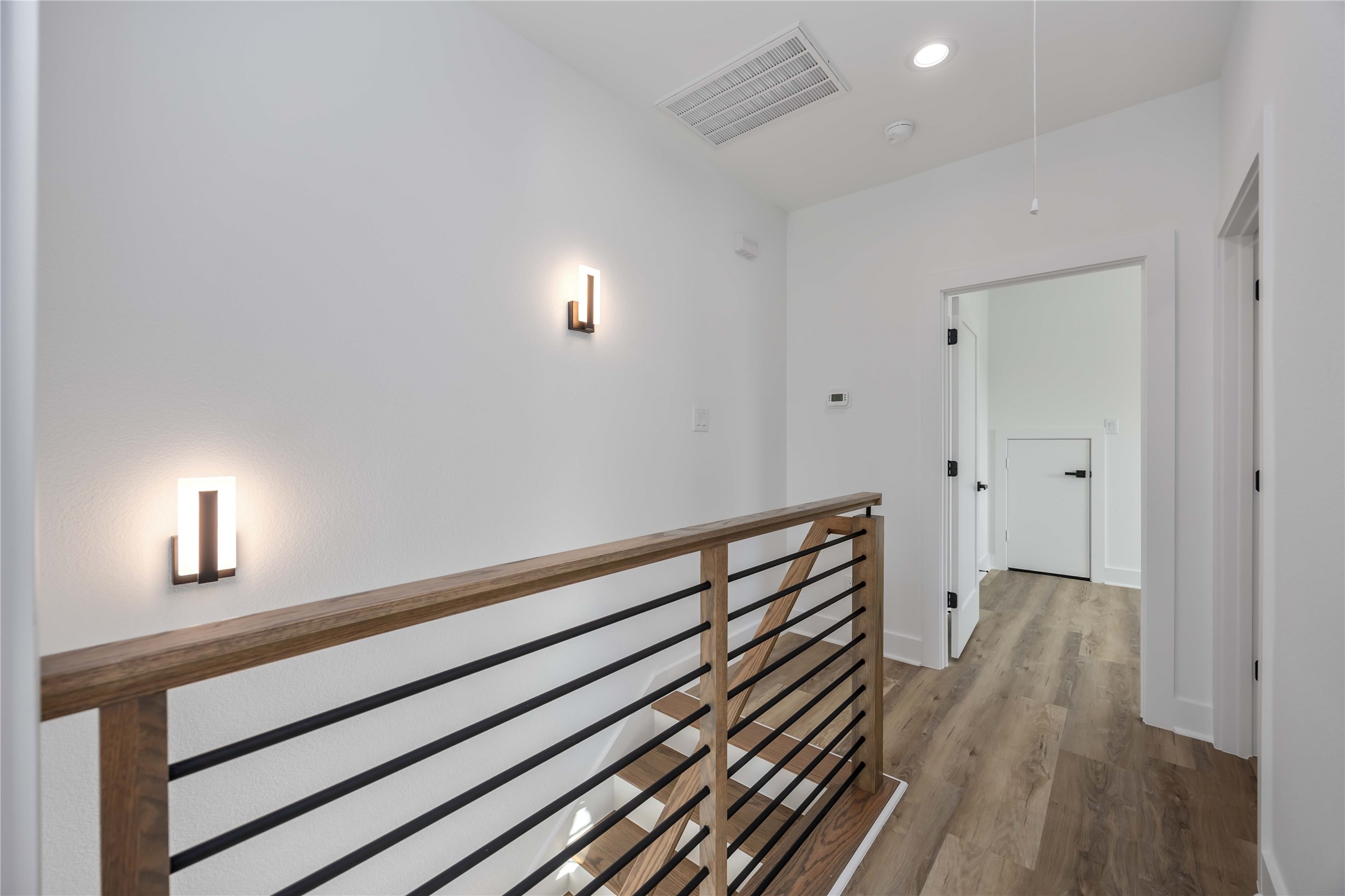 4533 Larkspur Street, Unit B Houston, TX 77051 - Photo 22 of 36 a view of a hallway with wooden floor and a window