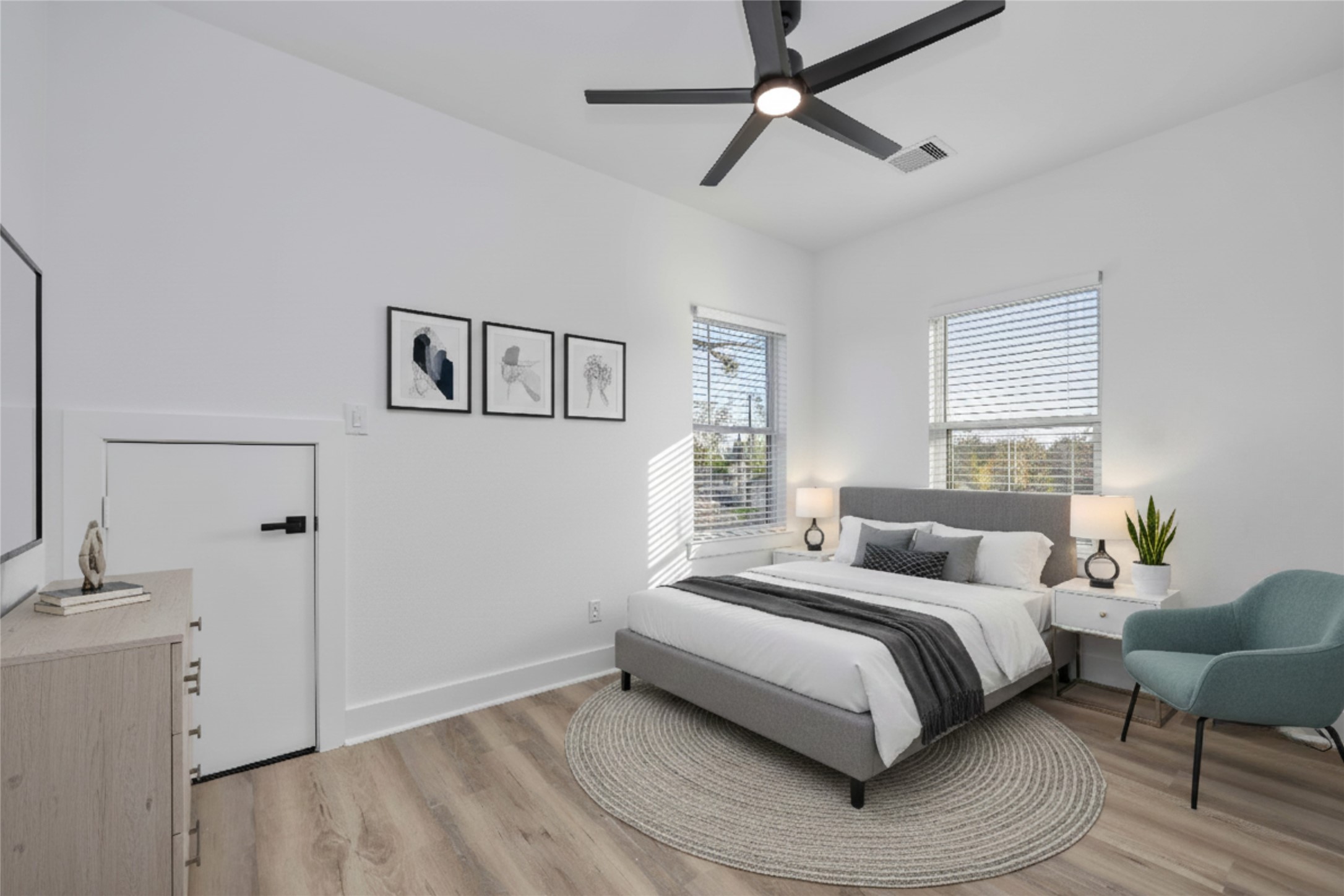 4533 Larkspur Street, Unit B Houston, TX 77051 - Photo 25 of 36 a bedroom with a bed and wooden floor