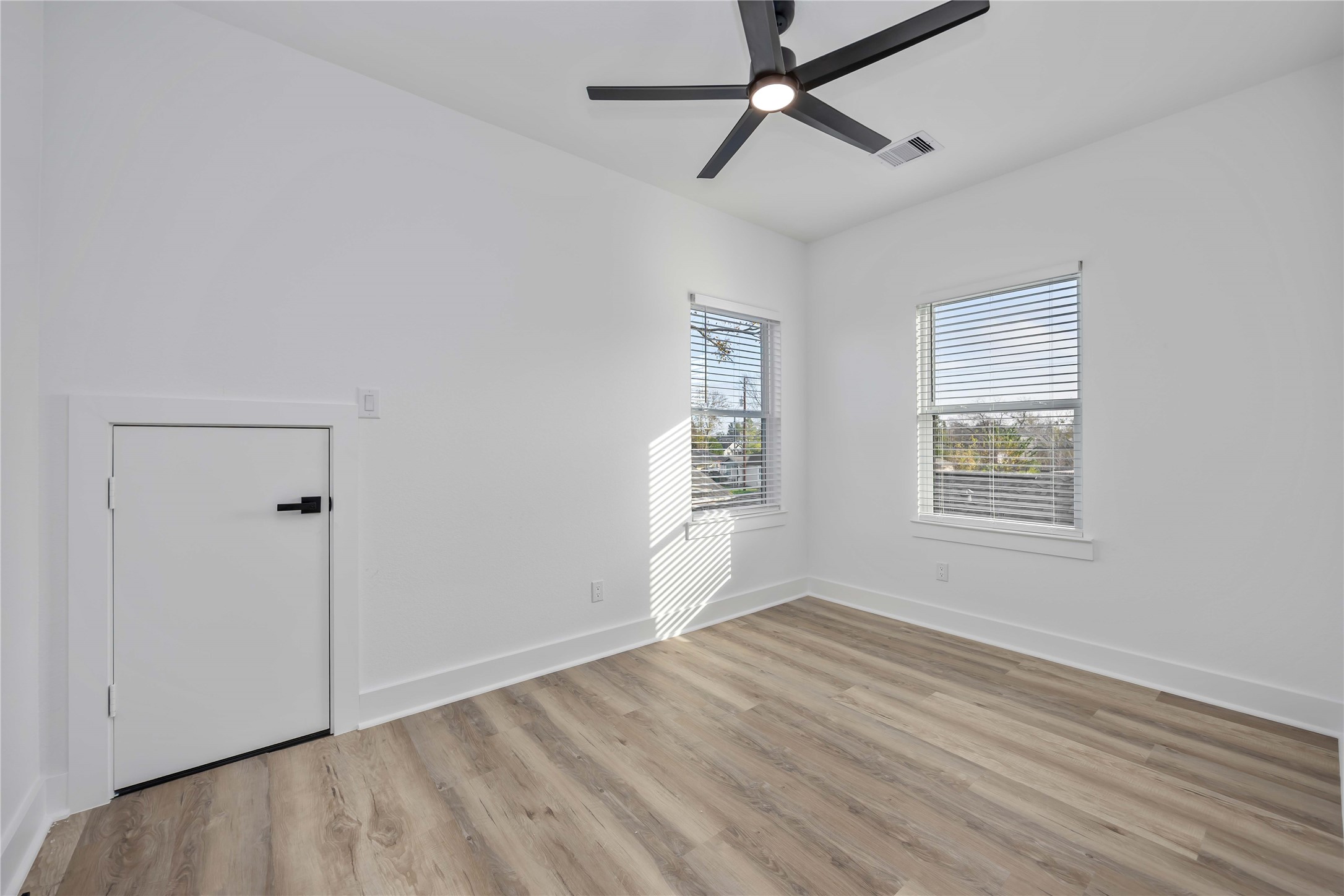 4533 Larkspur Street, Unit B Houston, TX 77051 - Photo 26 of 36 a view of room window and wooden floor