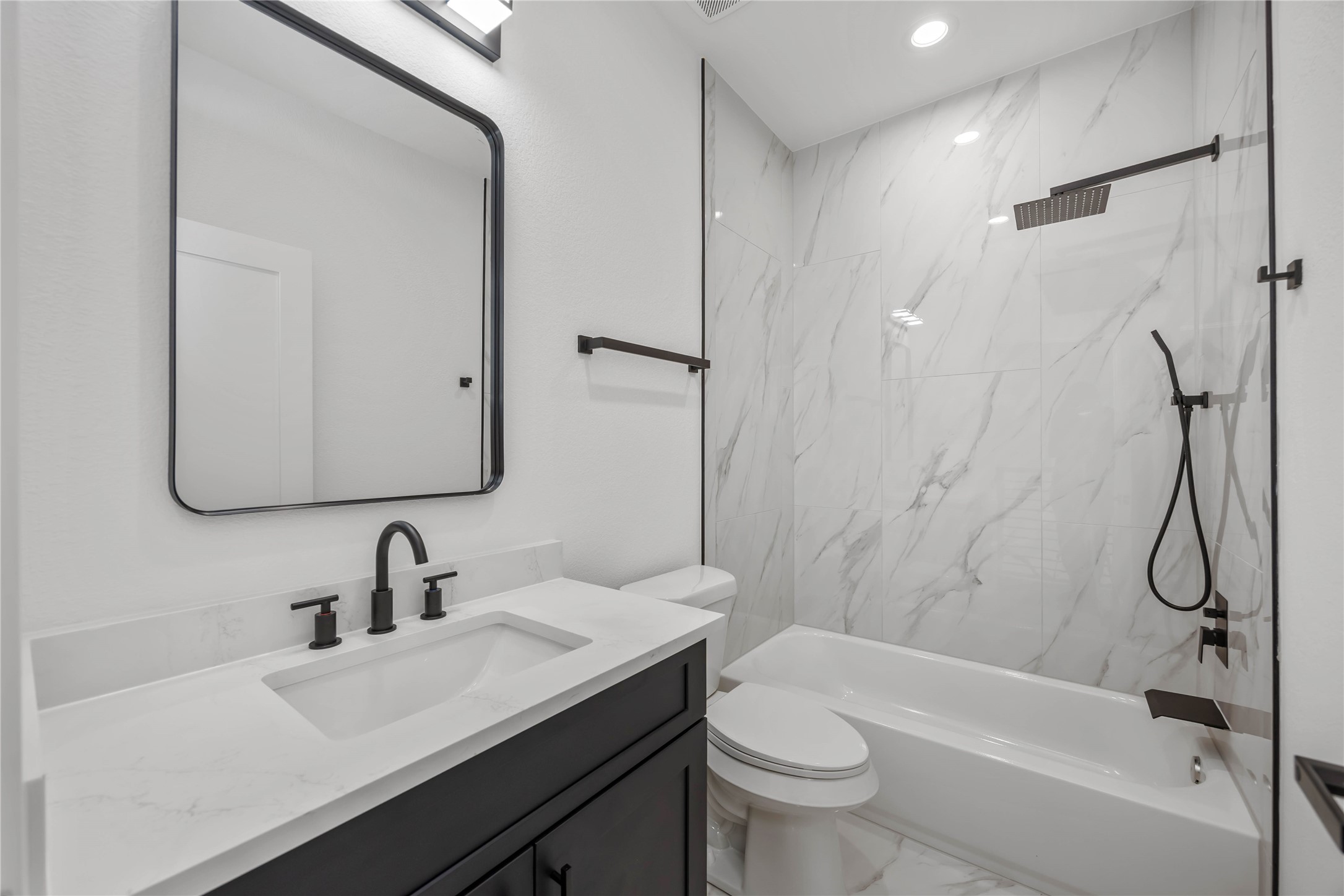 4533 Larkspur Street, Unit B Houston, TX 77051 - Photo 27 of 36 a bathroom with a sink a toilet and a mirror