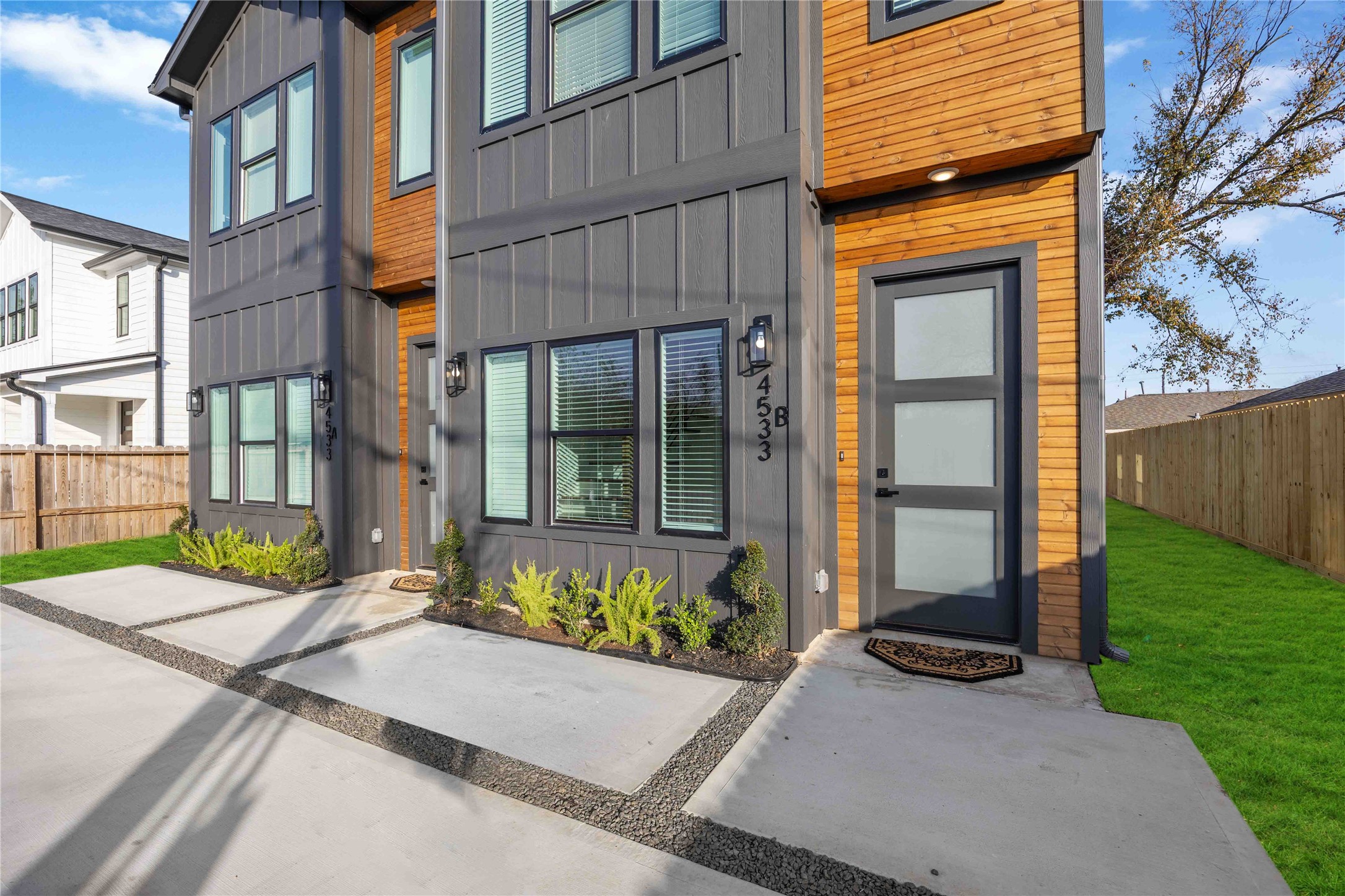 4533 Larkspur Street, Unit B Houston, TX 77051 - Photo 30 of 36 a view of a brick house with a large windows and a yard with plants