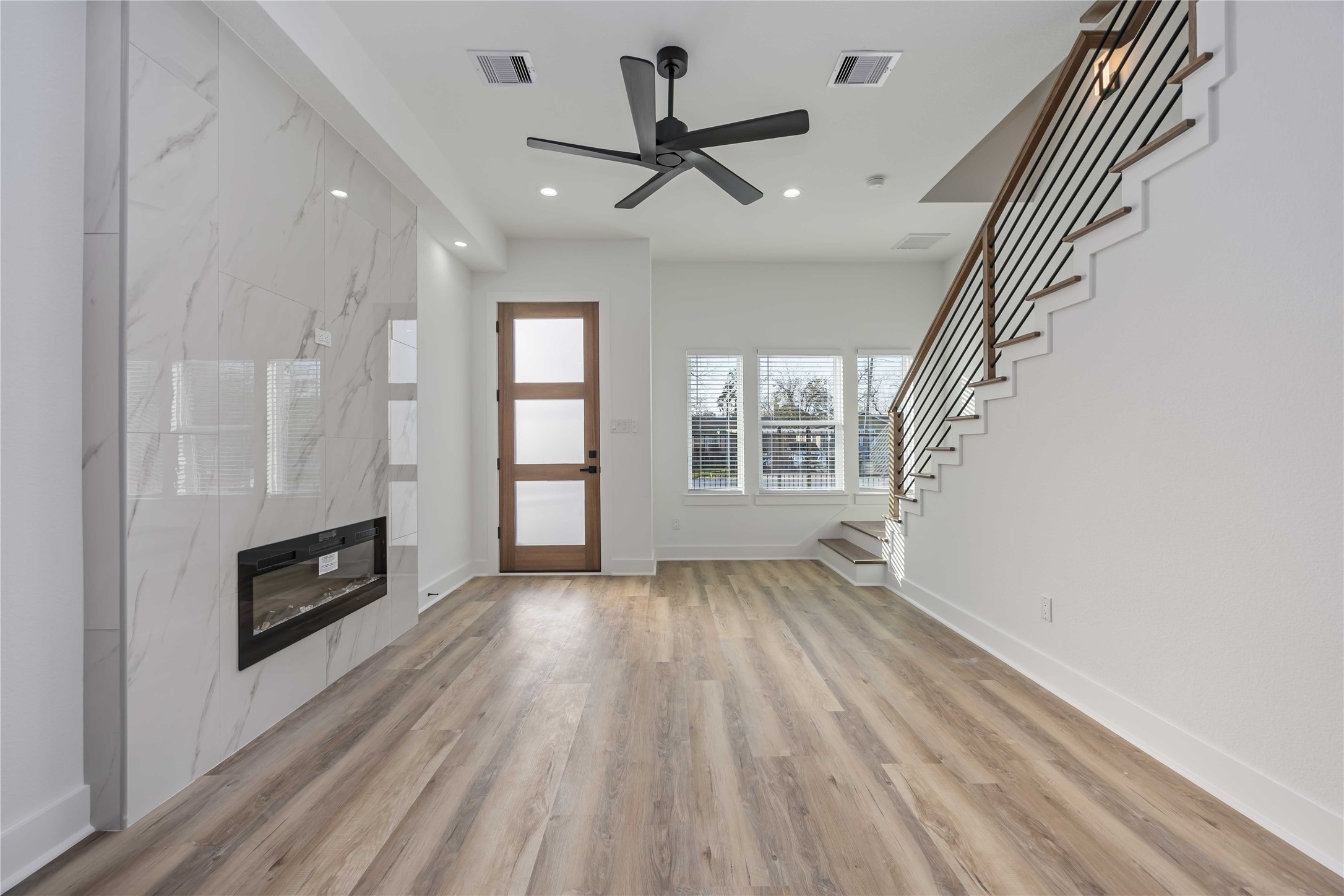 4533 Larkspur Street, Unit B Houston, TX 77051 - Photo 5 of 36 wooden floor in an empty room with a fireplace