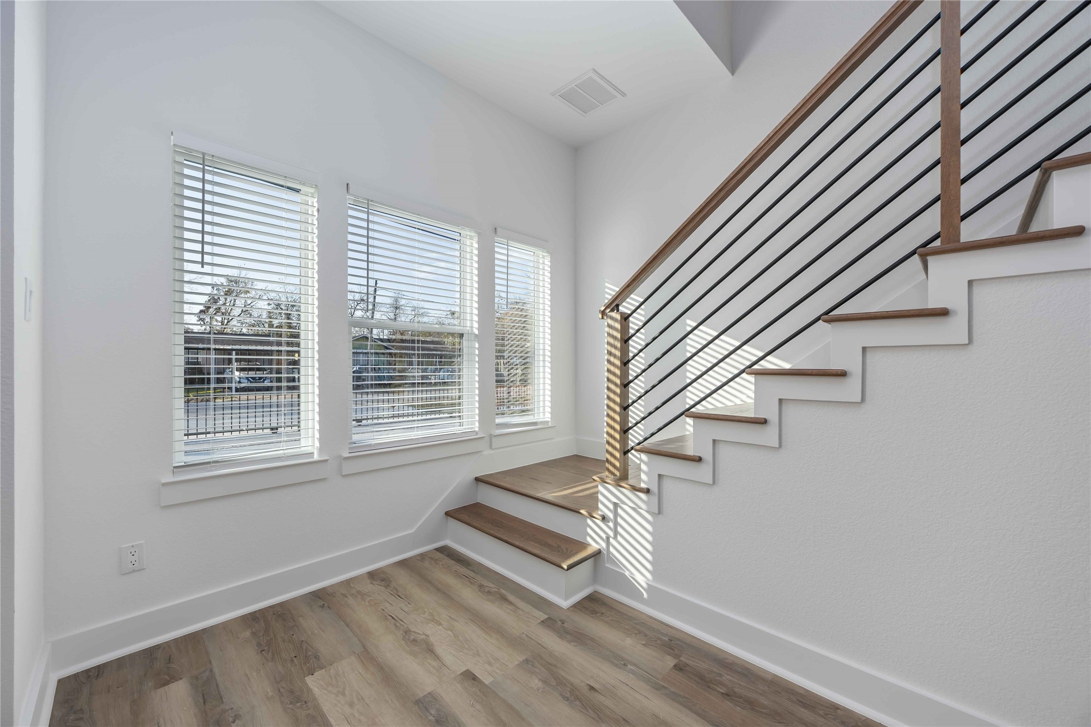 4533 Larkspur Street, Unit B Houston, TX 77051 - Photo 9 of 36 a view of entryway with stairs and wooden floor