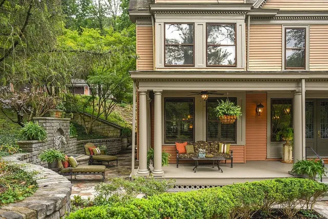 a view of a house with sitting area and garden